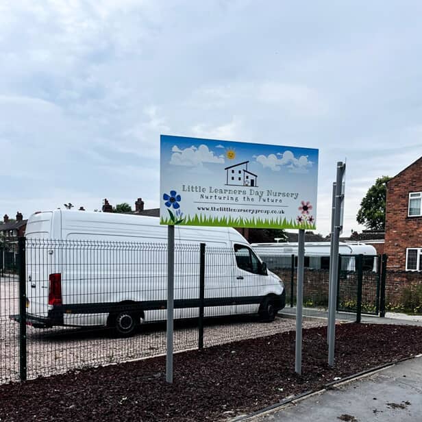 An image of the nursery's post and panel signs.